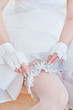 Garter on the leg of a bride