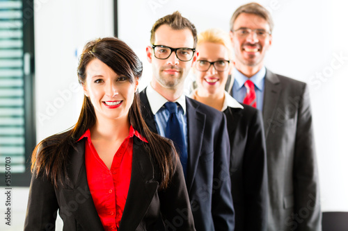 Photo: Business - group of businesspeople in office Business - group of businesspeople in office