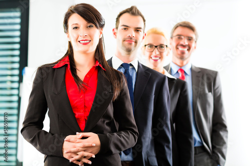 Photo: Business - group of businesspeople in office Business - group of businesspeople in office