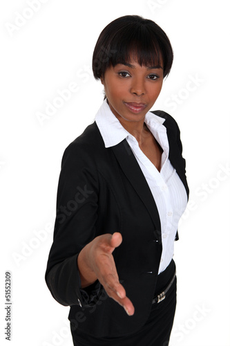 Photo: Businesswoman proffering her hand Businesswoman proffering her hand