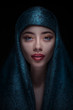 Portrait of a beautiful woman in paranja