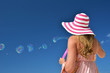 Girl making soap bubbles