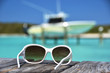 Sunglasses on the wooden jetty