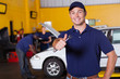 Photo: happy male mechanic giving thumb up happy male mechanic giving thumb up