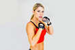 woman boxer, aggressive and looks at the camera
