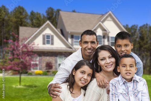 Photo: Hispanic Family in Front of Beautiful House Hispanic Family in Front of Beautiful House