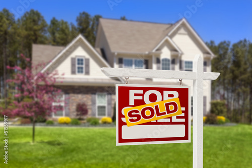 Photo: Sold Home For Sale Real Estate Sign and House Sold Home For Sale Real Estate Sign and House