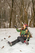 Beautiful woman in ski suit in snowy winter outdoors