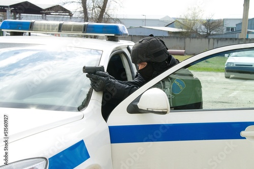 Photo: armed man in car armed man in car