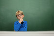 Foto: Schoolboy at the Blackboard Schoolboy at the Blackboard