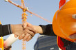 construction workers with crane in background