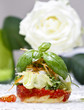 Halibut with fresh vegetables, white rose in the background