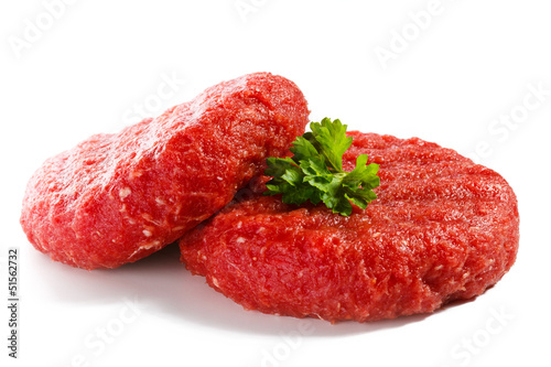 Photo: Raw beef and vegetables on white background Raw beef and vegetables on white background