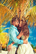 Wedding couple under a palm tree