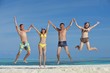 Photo: group of happy young people have fun on bach group of happy young people have fun on bach