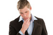Portrait of a young business man looking away and thinking