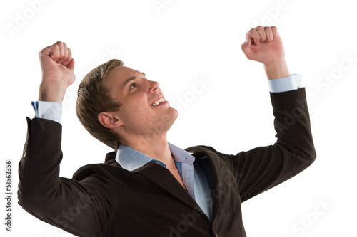 Photo: An excited young executive celebrating the success of his busine An excited young executive celebrating the success of his busine