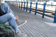 a person tying his shoes