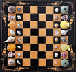 Chess board with sea shell, urchin and snail