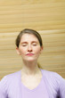 Woman meditating with closed eyes