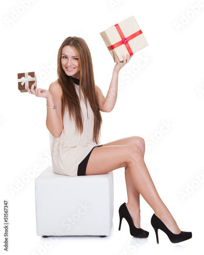 Photo: Young Woman Holding Gifts Young Woman Holding Gifts