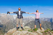 Young Couple at Top of the Mountain