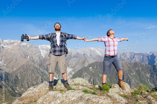 Photo: Young Couple at Top of the Mountain Young Couple at Top of the Mountain