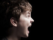 Profile of the shouting boy