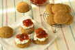 Home-baked scone with jam and cream