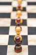 White and black chess pieces on a chessboard