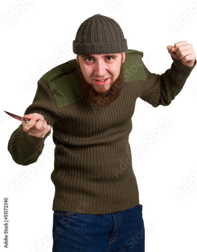 Photo: young bearded man with a knife young bearded man with a knife