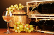 Wooden case with wine bottle, barrel, wineglass and grape