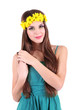 Young beautiful girl in green dress with bright wreath