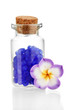 Little bottle full with colorful beads isolated on white