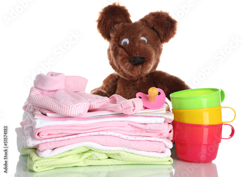 Photo: Pile of baby clothes isolated on white Pile of baby clothes isolated on white