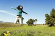 Photo: Teenage girl enjoying springtime in the field Teenage girl enjoying springtime in the field