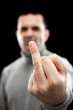 Foto: Man giving the finger (focus on hand) Man giving the finger (focus on hand)