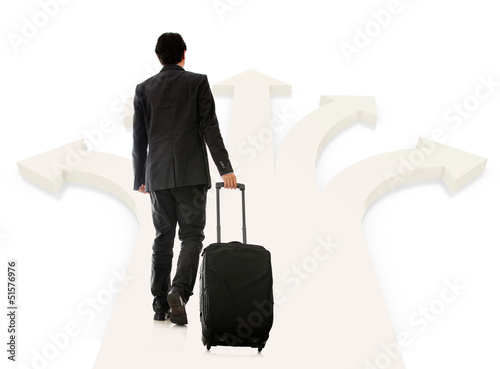 Photo: Business man picking next destination Business man picking next destination
