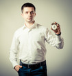 Alarm clock on businessman's hand