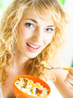 Cheerful woman eating cereal muslin