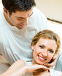 Cheerful smiling young couple, indoors