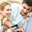 Cheerful couple paying by plastic card