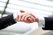 Photo: Business people handshaking closing a deal Business people handshaking closing a deal