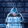 Hacker typing on a laptop