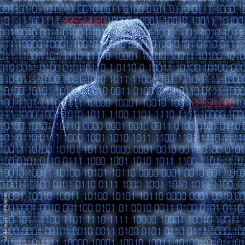 Photo: Silhouette of a hacker isloated on black Silhouette of a hacker isloated on black