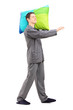 Full length portrait of a man sleepwalking and holding a pillow