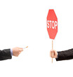 Man hand holding a stop sign and refusing a cigarette