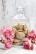 Parisian macarons among pink carnation flowers