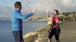 Vidéo : Female jogger with personal trainer jogging in exotic place Female jogger with personal trainer jogging in exotic place