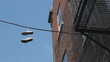 Sneakers hanging from wire. Montreal, Quebec.